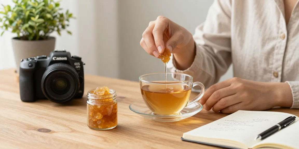 Person dissolving shilajit resin in herbal tea, promoting wellness.